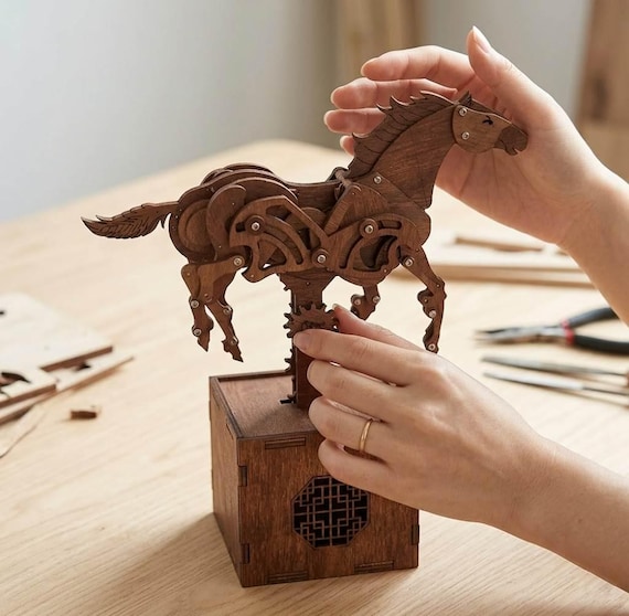 A fully mechanical wooden horse skeleton with exposed gear-driven movement — steampunk automaton craftsmanship that doubles as a conversation-starting art piece.