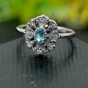 Blue Topaz Sterling Silver Ring: Oval Cut Flower Statement Ring