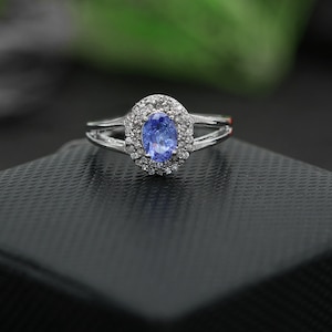 Oval Tanzanite Sterling Silver Ring: White Topaz Halo