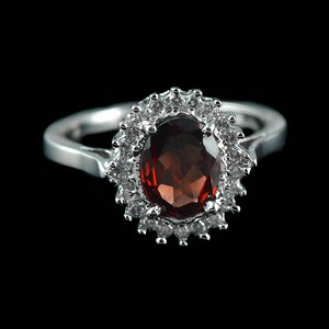 Garnet Ring: Oval Red Gemstone, White Topaz Halo, Sterling Silver