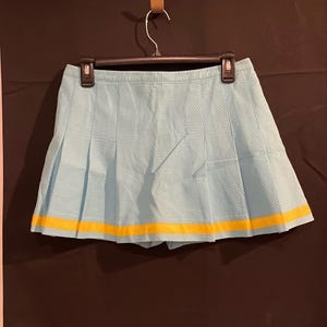Vintage Lilly Pulitzer Women's turquoise and yellow tennis skort size 4