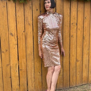 oleg cassini champagne dress Thought I'd show off my Oleg Cassini gown. I had the deep V-front closed into a sweetheart neckline and added the off-shoulder straps. I felt like a princess. Best part? I found