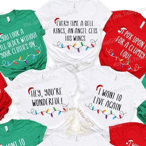 May include: A set of ten Christmas-themed t-shirts with various light-up string designs and humorous sayings. The shirts are in red, white, green, and black.