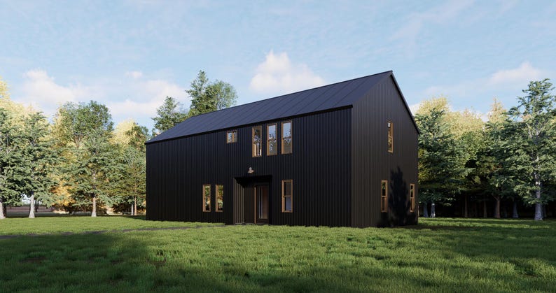 Pode incluir: Uma casa moderna preta com grandes janelas e um telhado de metal preto. A casa &eacute; cercada por &aacute;rvores e um gramado.