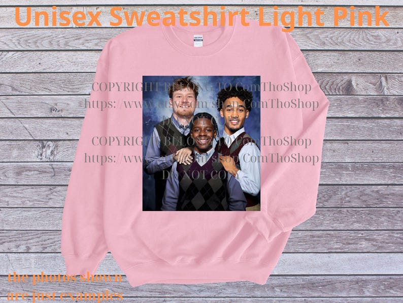 May include: Light pink unisex sweatshirt with a graphic of three people. The sweatshirt has the text "Unisex Sweatshirt Light Pink" at the top. The image on the sweatshirt is a group photo of three people wearing vests and collared shirts.