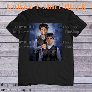 May include: Black unisex t-shirt featuring a photo of two men wearing argyle vests over collared shirts. The text "Unisex T-shirt Black" is at the top. The shirt also has text that says "COPYRIGHT BELONG TO Com ThoShop" and "the photos shown are just examples."