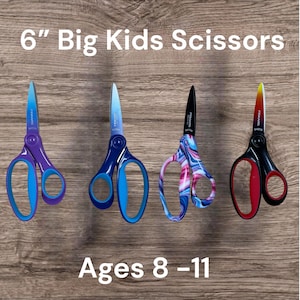 May include: Four pairs of 6" Big Kids Scissors for ages 8-11. The first pair is purple and blue, the second is dark blue and light blue, the third has a pink and blue swirl pattern with a black blade, and the fourth is black and red.