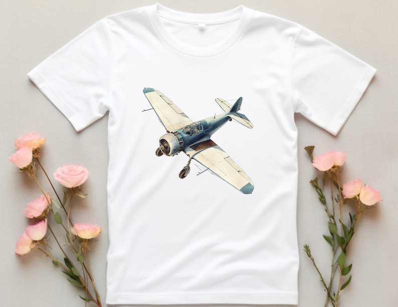 Op de afbeelding: Wit T-shirt met een vintage illustratie van een blauw en wit vliegtuig.