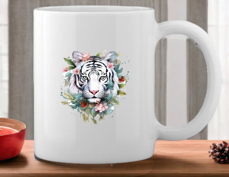 May include: White ceramic mug with a watercolor illustration of a white tiger's face surrounded by flowers and leaves.