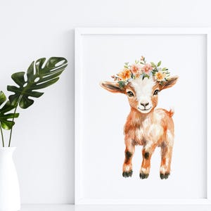 May include: A watercolor painting of a brown baby goat wearing a flower crown. The goat is standing on a white background.