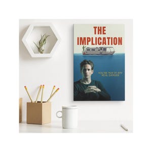 May include: A poster with a blue background featuring a man in a black shirt and the text "THE IMPLICATION" in red and white. The text "YOU'RE NOT IN ANY REAL DANGER" is in yellow. A boat is partially submerged in the water.