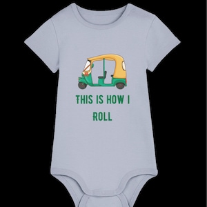 May include: A light blue baby onesie with a green and yellow cartoon auto rickshaw and the text "This is how I roll".