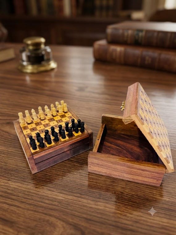 A peg-style wooden travel chess set with built-in storage — genuinely portable, handcrafted, and the kind of gift that actually gets used.
