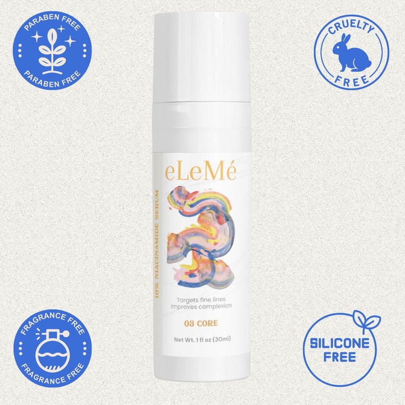 May include: A white eLeM&eacute; serum bottle with a colorful abstract design. The bottle has text that reads "10X Niacinamide Serum", "Targets fine lines improves complexion", and "03 CORE". The bottle is 1 fl oz (30ml). The image also includes "Paraben Free", "Cruelty Free", "Fragrance Free", and "Silicone Free" labels.