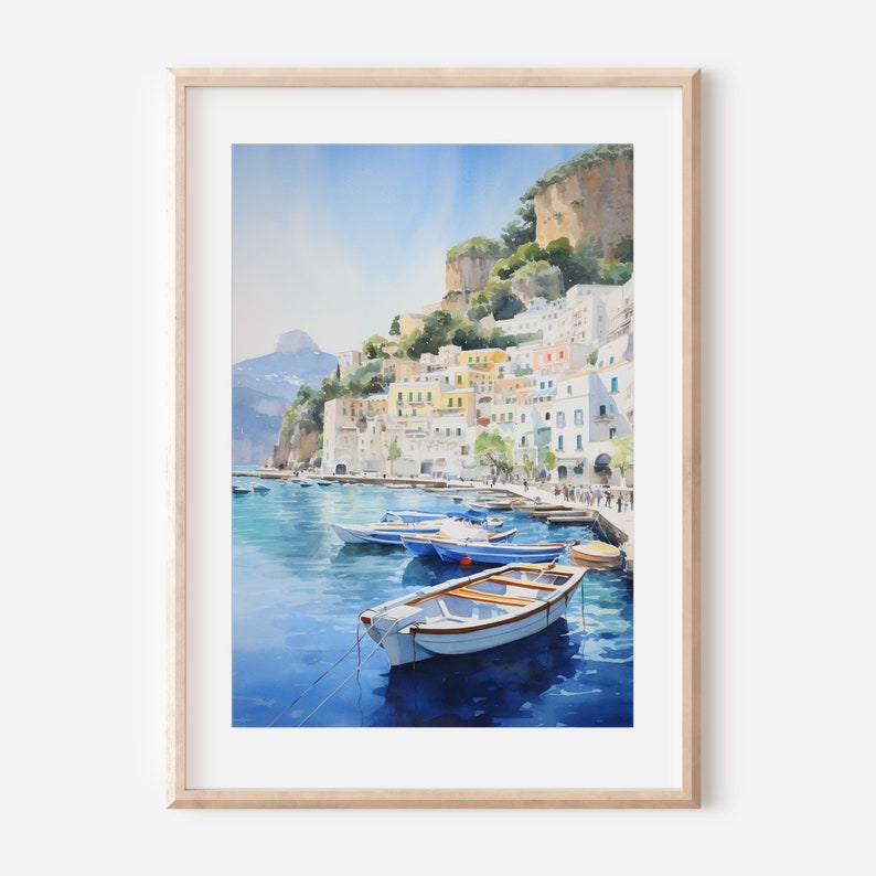 May include: Watercolor painting of a colorful Italian village on a cliffside overlooking a harbor with boats. The water is a deep blue and the sky is a light blue. The buildings are white with colorful accents.