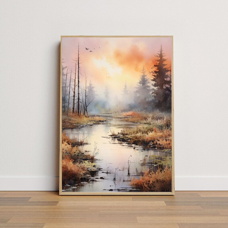 May include: A watercolor painting of a misty forest scene with a winding river in the foreground. The sky is a soft orange and pink, and the trees are a muted green and brown. The painting has a peaceful and serene atmosphere.