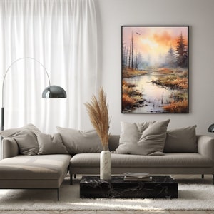 May include: A watercolor painting of a misty forest scene with a river winding through the trees. The sky is a soft orange and pink, and the trees are a dark green. The painting is framed in black.