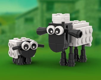 May include: Two sheep figures constructed from white and black plastic building blocks. The larger sheep features a white body, black head, and prominent round eyes, while the smaller sheep is a miniature version with similar features and colors.