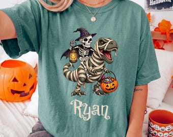Skeleton Riding Mummy Dinosaur Comfort Colors® Shirt, Funny Halloween T Rex Tee, Pumpkin Spooky Dino Toddler Tees