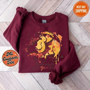 a red shirt with a picture of a monkey on it