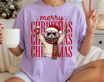 Comfort Colors® Christmas Raccoon Shirt, Merry Holiday Graphic Tee, Raccoon in Santa Hat Graphic Shirt