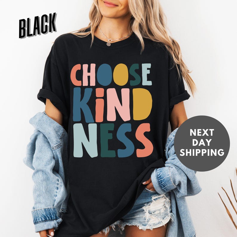a woman wearing a black t - shirt that says choose kind of nesss next