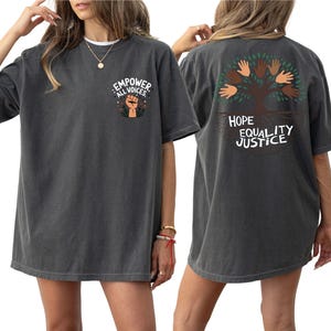 a woman wearing a t - shirt with a tree on it