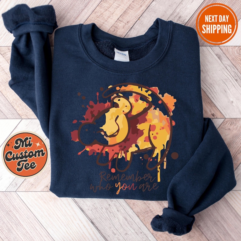 a blue sweatshirt with a lion on it