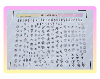 May include: A sheet of nail art stickers with a variety of floral designs, including roses, leaves, and other flowers. The sheet also includes a full alphabet and numbers in a handwritten font. The text on the sheet reads "Sticker it with love" and "nail art sheet".
