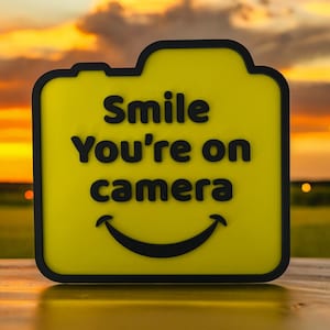 Smile You’re on Camera | Security Camera Sign | Yellow with Black | Includes Adhesive Strips