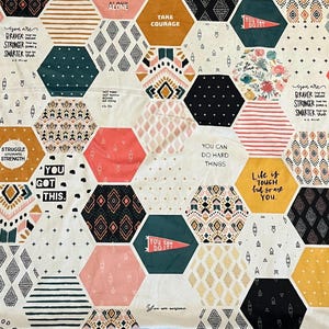 May include: A white fabric with a hexagonal pattern featuring various inspirational quotes and geometric designs in black, pink, yellow, and green. The quotes include "You Got This", "You Can Do Hard Things", "Life is Tough but so are You", and "Take Courage".