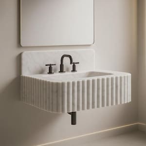 Carrara marble bathroom sink with premium natural stone veining, handcrafted from solid Carrara marble with a 6-inch rounded backsplash. Wall-mounted or countertop installation, modern minimalist luxury bathroom design. High-end 3-hole faucet installed, polished surface, durable natural stone craftsmanship. Perfect for luxury interior design projects, small bathrooms, powder rooms, hotels, and modern home renovations. Premium quality, handcrafted marble vanity sink shipped worldwide via DHL
