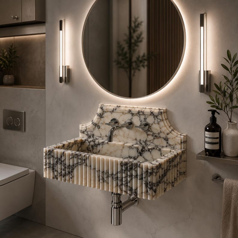 Luxury handcrafted Calacatta Viola marble floating wall mounted bathroom sink with sculptural fluted front and architectural backsplash in a premium designer bathroom.