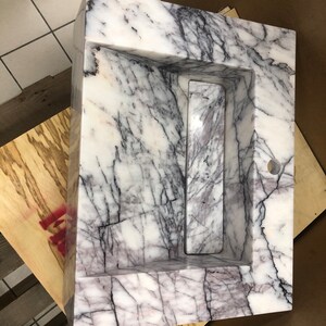 carrara-floating-sink-bathroom-visualization.jpg Styled bathroom visualization showing how the custom Carrara marble wall-mount sink may look after installation.