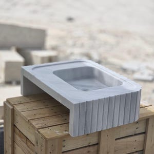 Elegant Bathroom Sink - Hand-Carved White Marble Bathroom Sink – Wall-Mounted or Countertop, Rectangular Vessel, Customizable Design - Close up of polished white marble sink bowl carved from a single block of natural stone ideal for modern and minimalist vanity designs