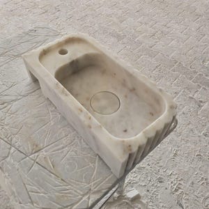 Handcrafted marble sink, Carrara marble basin, custom stone washbasin for bathroom, wall mounted and countertop vessel sink, natural stone vanity bowl, luxury bathroom design, Italian marble handmade sink, unique veined stone, elegant bathroom interior, artisanal stonework, real marble powder room sink, modern minimalist bathroom decor, durable and stylish marble sink, bathroom remodel ideas, hotel and yacht sink design