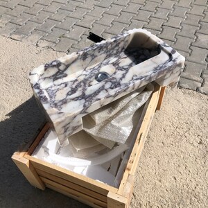 MarbleSinkCo customization graphic explaining that handmade natural marble sinks can be produced in custom sizes and stone types.
