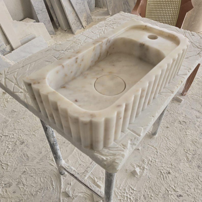 Handcrafted marble sink, Carrara marble basin, custom stone washbasin for bathroom, wall mounted and countertop vessel sink, natural stone vanity bowl, luxury bathroom design, Italian marble handmade sink, unique veined stone, elegant bathroom interior, artisanal stonework, real marble powder room sink, modern minimalist bathroom decor, durable and stylish marble sink, bathroom remodel ideas, hotel and yacht sink design