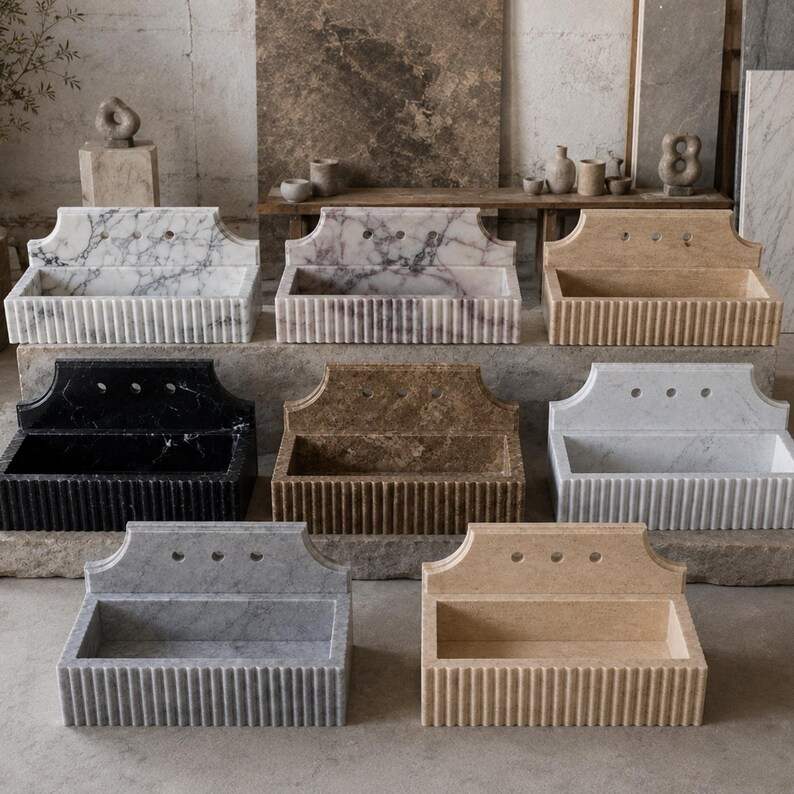 Luxury handcrafted Calacatta Viola marble floating wall mounted bathroom sink with sculptural fluted front and architectural backsplash in a premium designer bathroom.