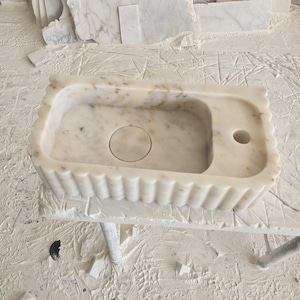 Handcrafted marble sink, Carrara marble basin, custom stone washbasin for bathroom, wall mounted and countertop vessel sink, natural stone vanity bowl, luxury bathroom design, Italian marble handmade sink, unique veined stone, elegant bathroom interior, artisanal stonework, real marble powder room sink, modern minimalist bathroom decor, durable and stylish marble sink, bathroom remodel ideas, hotel and yacht sink design