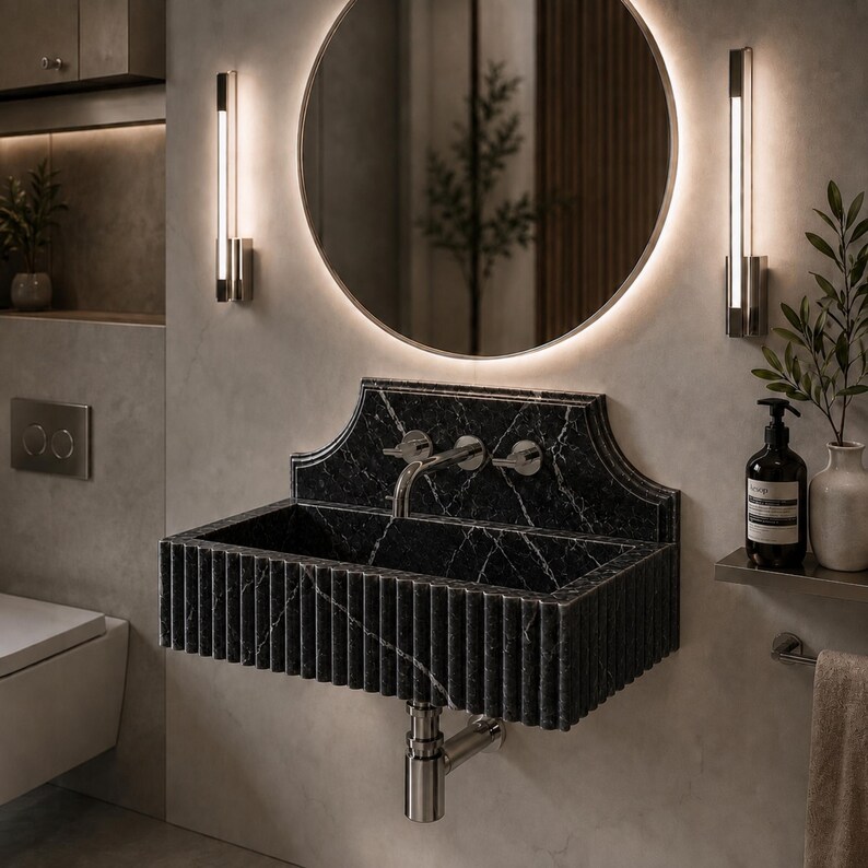 Luxury handcrafted Calacatta Viola marble floating wall mounted bathroom sink with sculptural fluted front and architectural backsplash in a premium designer bathroom.