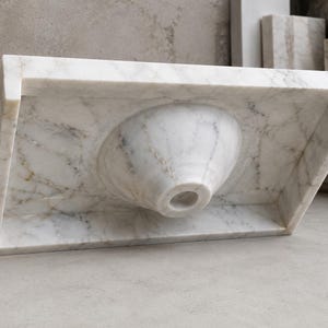 Calacatta Gold marble vessel sink displayed as a countertop bathroom basin, handmade from real natural stone with polished surface and luxury veining