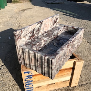 Hand carved Calacatta Viola marble sink produced by skilled marble artisans, real natural stone bathroom basin made for custom luxury homes, hotels, architects, and interior designers
