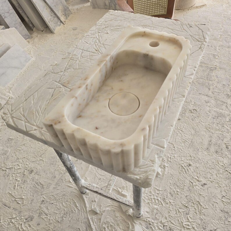 Handcrafted marble sink, Carrara marble basin, custom stone washbasin for bathroom, wall mounted and countertop vessel sink, natural stone vanity bowl, luxury bathroom design, Italian marble handmade sink, unique veined stone, elegant bathroom interior, artisanal stonework, real marble powder room sink, modern minimalist bathroom decor, durable and stylish marble sink, bathroom remodel ideas, hotel and yacht sink design