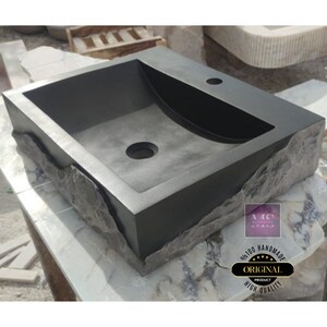 🖤 Discover the timeless beauty of our handcrafted rectangular black lava stone sink, carved from natural volcanic basalt. Perfect for wall-mounted, countertop, or vessel installations. Each piece is uniquely veined and artisan-crafted for luxury bathrooms. A bold statement for modern interior design. Durable, water-resistant, and shipped worldwide in a protective wooden crate via DHL Express.