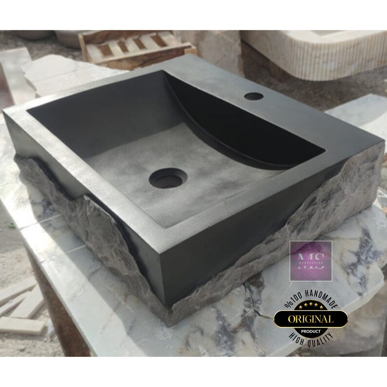 🖤 Discover the timeless beauty of our handcrafted rectangular black lava stone sink, carved from natural volcanic basalt. Perfect for wall-mounted, countertop, or vessel installations. Each piece is uniquely veined and artisan-crafted for luxury bathrooms. A bold statement for modern interior design. Durable, water-resistant, and shipped worldwide in a protective wooden crate via DHL Express.