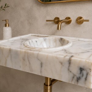 handmade-marble-vessel-basin-bathroom-sink.jpg First processing stage of Calacatta marble block in the workshop, measured and precision cut before being shaped into a luxury stone sink