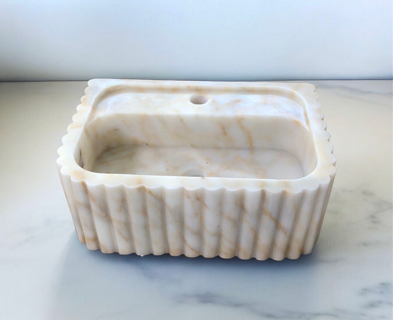 #HandCarvedSink #CalacattaViolaMarble #CustomizableVanityTop #CustomizableSink #BathroomSink #PowderRoomSink #FarmhouseSink #RareUniqueItem #WallMountSink #VesselSink #NaturalStoneSink #MarbleBathroomSink #LuxuryBathroomDecor #MarbleSinkCo