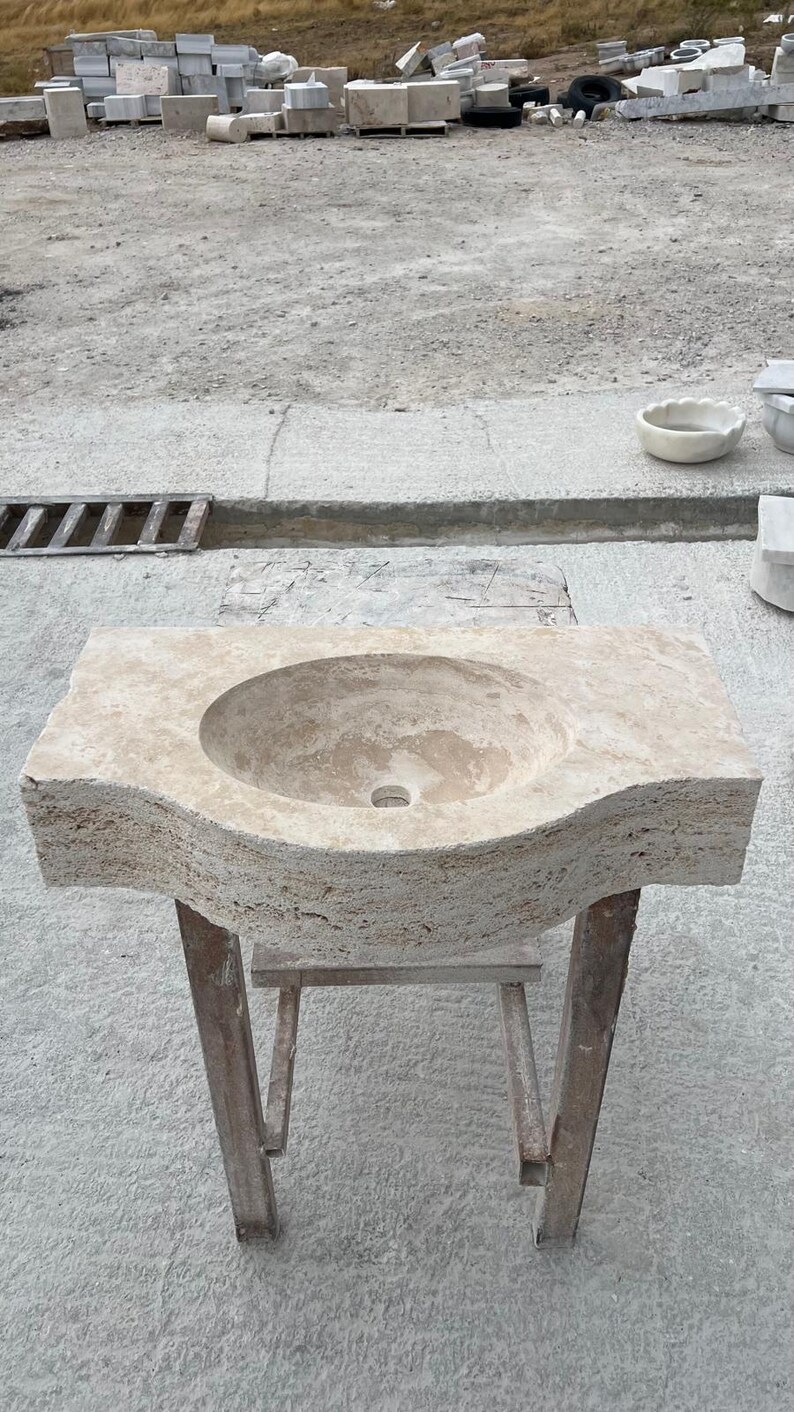 Hand-carved rectangular beige travertine countertop vessel sink with a smooth honed basin, rough chiseled exterior, centered drain and single faucet hole, custom-size natural stone bathroom washbasin by MarbleSinkCo.
