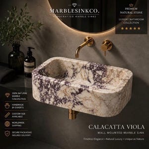 Luxury handcrafted Calacatta Viola marble floating wall mounted bathroom sink with fluted front in a premium designer bathroom.